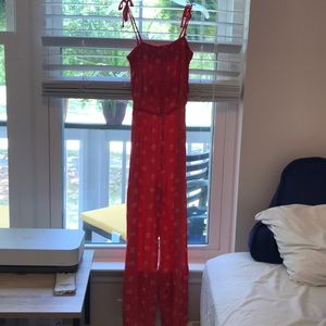 Coral and white elephant romper.